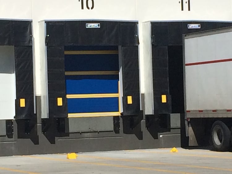 design the loading dock: determine the door, loading dock door with dock seal