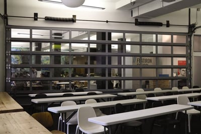 Aluminum glass sectional door used to seperate meeting rooms at the workplace.